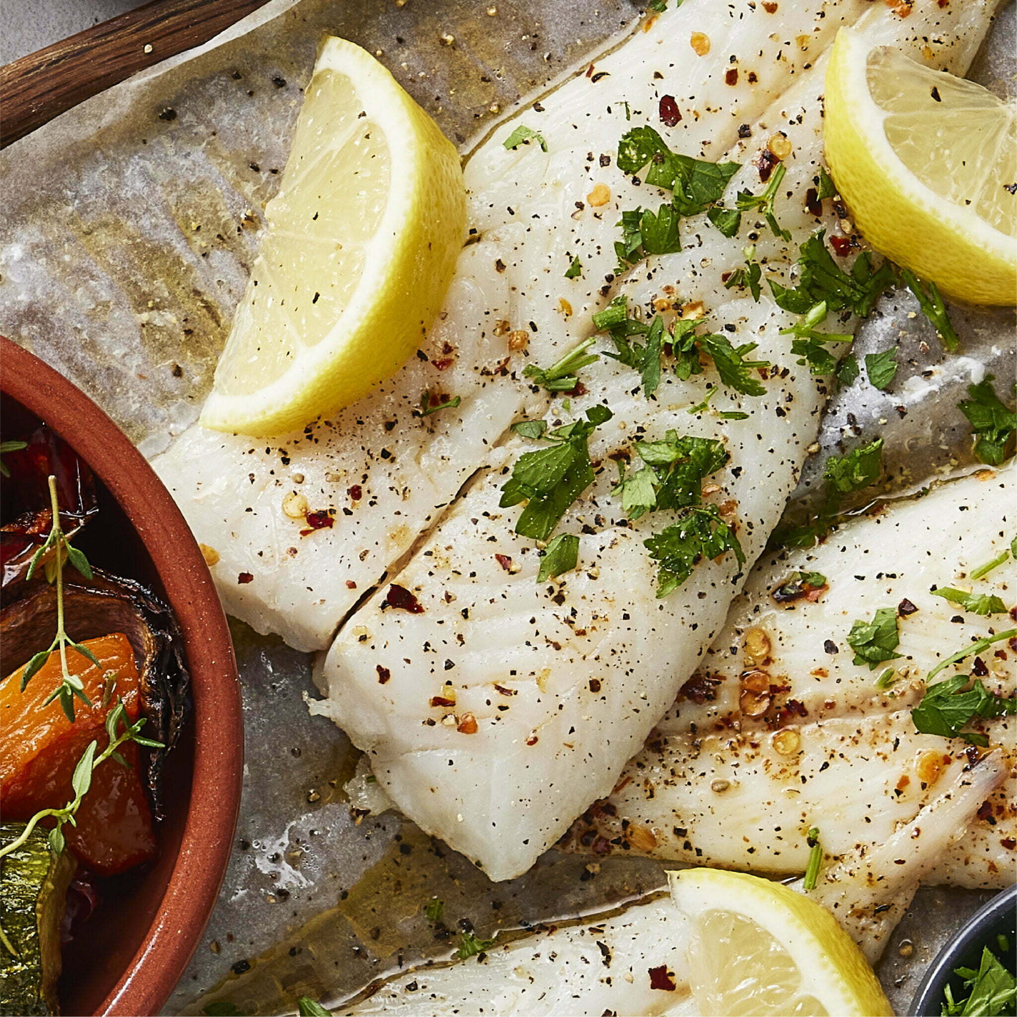 GRILLED HAKE FILLETS WITHLEMON BUTTER, MASH & ROAST VEGETABLES I&J